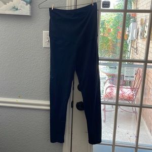 Over the belly dark blue full length leggings spandex and nylon. Like new
